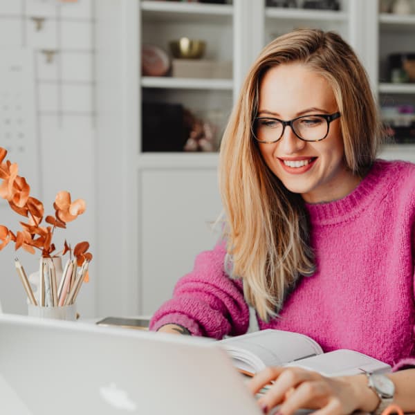 Homebuyer using a laptop to search for houses for sale online